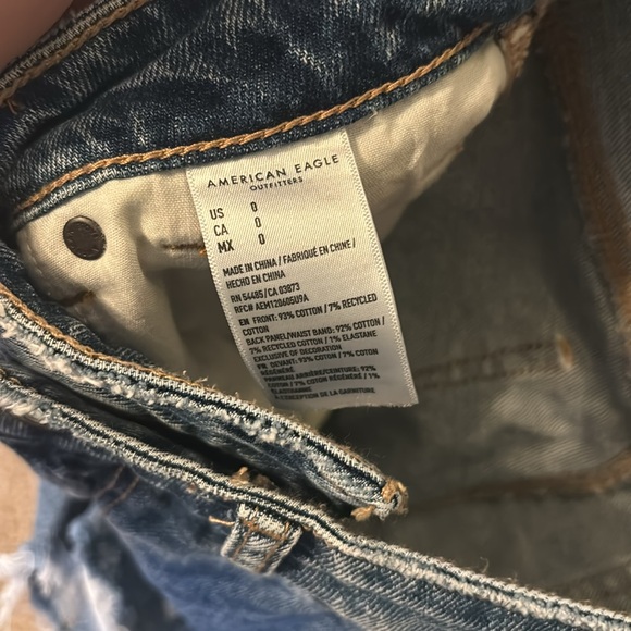 Size 0 American Eagle blue Asymmetrical Jean Shorts. Brand New, never worn. - Picture 4 of 4